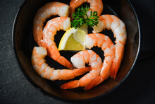Shrimps Prawns Seafood Plate Cooked On Pan With Herbs And Spices Lemon And Curly Parsley