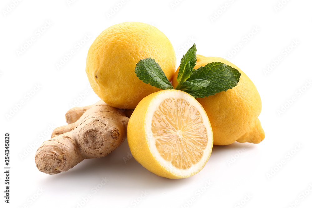 Fresh lemon with ginger and mint on white background