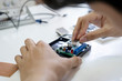 © ijeab - Technician checks the electronic device.
