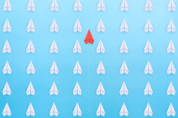 Wall Mural - Group of paper planes in one direction and with one individual pointing in the different way. New idea, Unique way and Business for innovative solution concept.