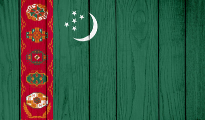 Flag of Turkmenistan on wooden background