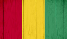 Flag Of Guinea On Wooden Background