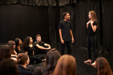 Male And Female Drama Students At Performing Arts School In Studio Improvisation Class