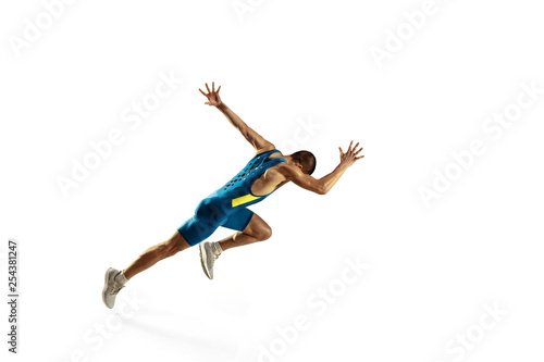 Fotomural Young caucasian man running isolated on white studio background