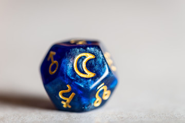 astrology dice with symbol of the moon