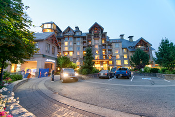 Sticker - WHISTLER, CANADA - AUGUST 12, 2017: Tourists visit city center on a summer night. Whistler is a famous mountain destination in British Columbia