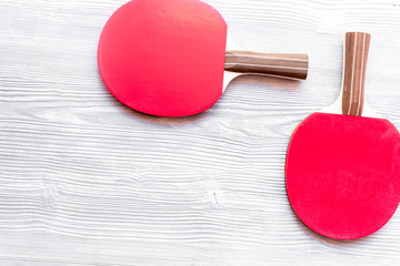 Wall Mural - Red racket for ping pong ball wooden background top view