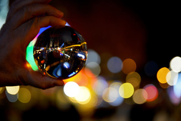 Wall Mural - lens ball on colorful bokeh background