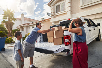 Wall Mural - hispanic family unloading pickup truck and moving into new house in las vegas