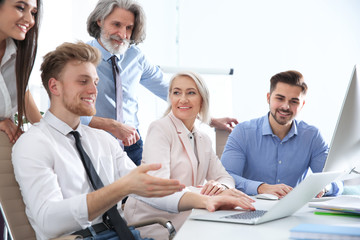 Poster - Business people discussing work matters at table in office. Professional communication