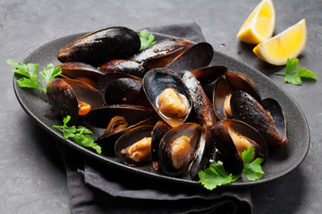 delicious mussels with tomato sauce and parsley