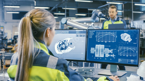 Fotomural At the Factory: Female Mechanical Engineer Designs 3D Engine on Her Personal Computer