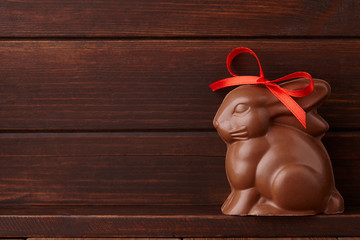 Wall Mural - Chocolate Easter bunny gift with red bow