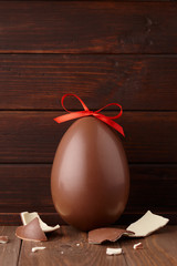 Wall Mural - Chocolate Easter egg gift with red bow