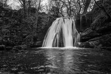 Black And White Image Of  Janet's Foss At Malham In The Yorkshire Dales, England, Taken On A Long Exposure To Smooth Out The Water, Taken At Water Leve