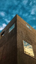 Brown Concrete Building Under Cloudy Sky During Daytime
