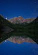 © Sara Vozel/Scopio - Mountain reflected in water under starry night sky