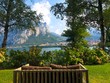 © Danielle Tolchin/Scopio - indoor brown wooden bench with ocean and mountain background