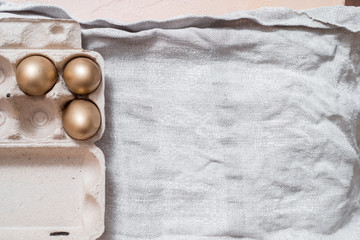 photo of three golden eggs on grass to represent wealth and luck