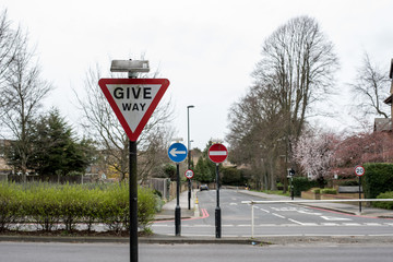 London, UK - March 2019: UK road signs showing speed, give way, one way and no entry signs