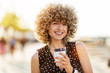 © pikselstock - Portrait of young woman with curly hair