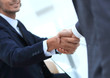 © ASDF - closeup.colleagues shaking hands