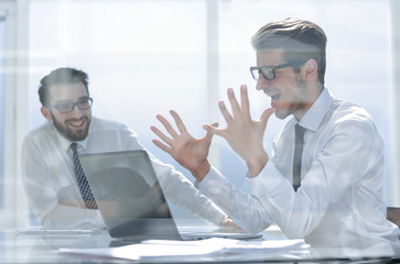 Excited employees enjoying the good news on the Internet