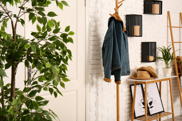 Canvas Print - Stylish hallway interior with hanger stand and table