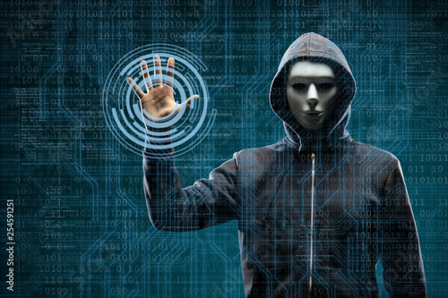 Fotografía Computer hacker in mask and hoodie over abstract binary background