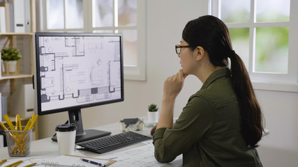 blueprint architect construction project sketch concept. side view of elegant female engineer though