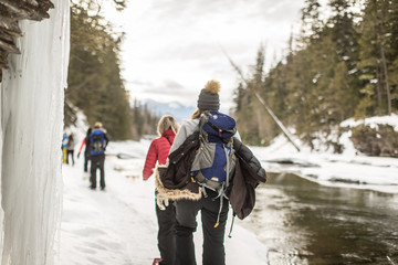 women snow shoeing