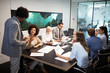 © NDABCREATIVITY - Business colleagues in conference meeting room presentation