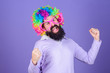 © be free - Having fun. Holiday fun and carnival concept. Man bearded wear colorful wig and funny glasses on violet background. Clown and circus. Party fun. Enjoy being crazy. Feel free to express yourself