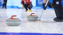 Curling Player Throw And Delivering A Stone On A Curling Rink, Sliding Over Ice
