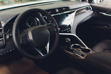 Canvas Print - Interior view of car with black salon. steering wheel, auto