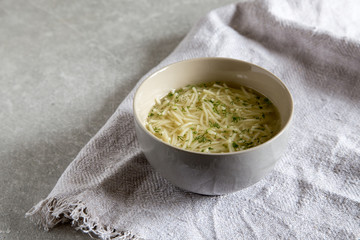 Bowl of chicken noodle soup. Homemade tasty Chicken soup in white bowl.