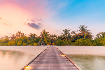 Beautiful sunset beach scene. Colorful sky and clouds view with calm sea and relaxing tropical mood 