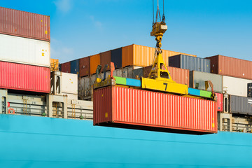 Cargo ship being loaded with containers at port in Chile