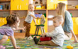 © Oksana Kuzmina - Nursery babies with mentor playing in kindergarten