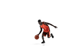 Full Length Portrait Of A Basketball Player With A Ball Isolated On White Studio Background. Advertising Concept. Fit African Anerican Athlete With Ball. Motion, Activity, Movement Concepts.
