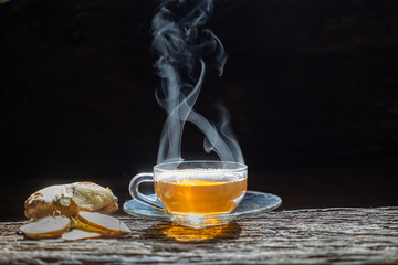 Wall Mural - Hot Ginger juice and mint with lemon and honey of ginger on wood background.healthy drinks