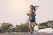 © only_kim - young woman runner running on running road in city park