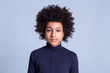 © zinkevych - Calm African American boy with wild hairstyle posing on monochromic background
