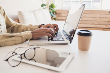 Men student working on computer. Businessman using laptop at home. Internet marketing, freelance work, online education concept