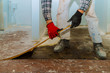 © ungvar - Handyman during work of removing oldlaminated parquet flooring