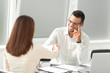 © yurolaitsalbert - handshake between the Manager and the client in a bright office