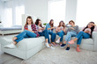 © deagreez - Full length body size photo beautiful she her six diversity ladies family roommates sisters look telephones not care had fight not speak tell talk sit sofa bright white room girls day night indoors