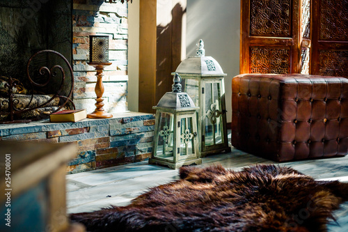 Vintage Brown Leather Sofa Pelt Of Bear Candles And Lanterns In