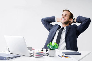 Relaxing or dreaming businessman at office