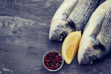 Wall Mural - raw fish with olive oil and lemon background